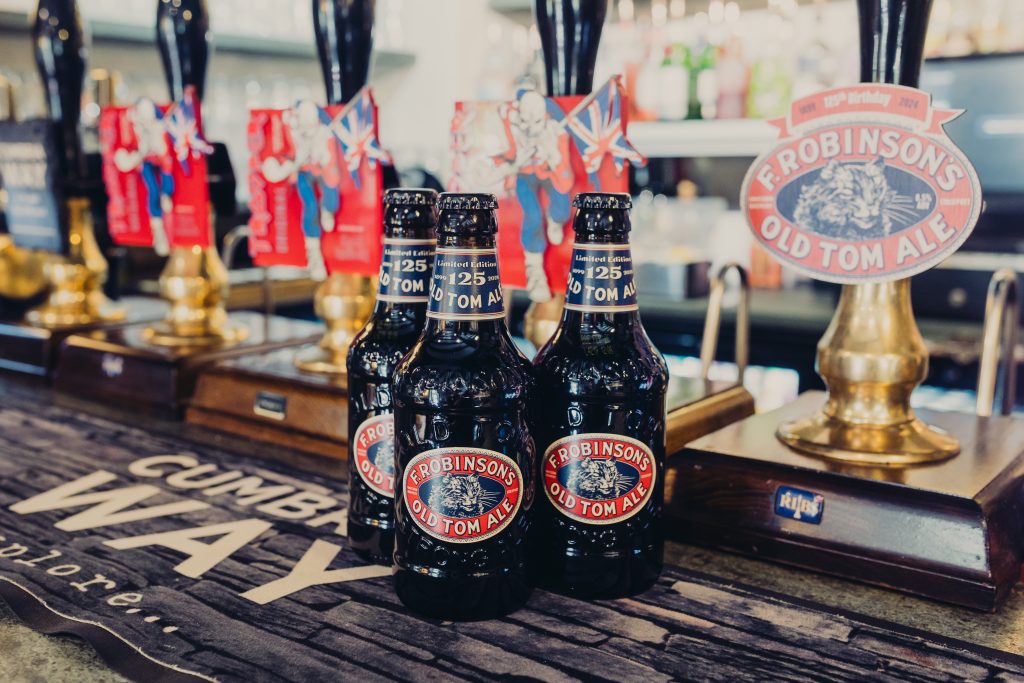 Bottles of Old Tom and Old Tom Pump Clip on the bar